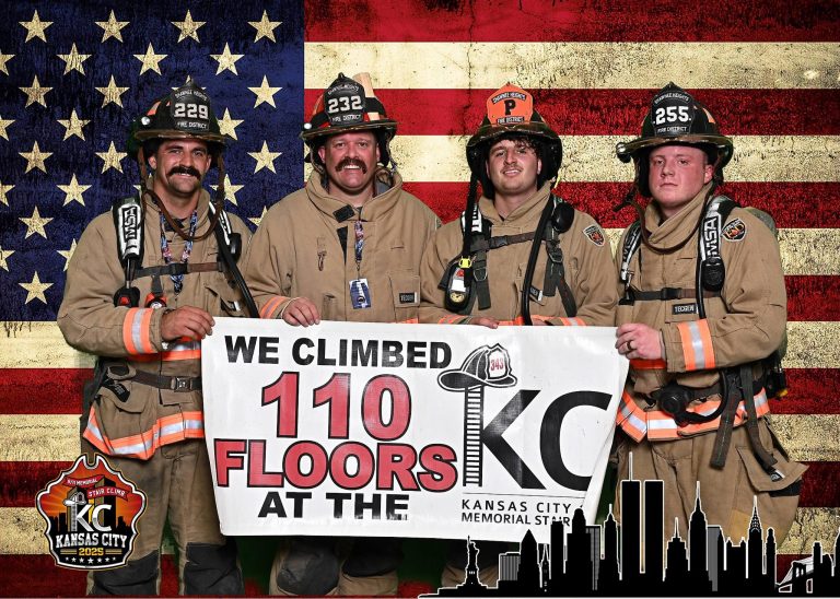 Four firefighters in full gear stand in front of an American flag, holding a banner that reads, "We climbed 110 floors at the KC Kansas City Memorial Stair Climb." Event logos decorate the corners of the image.