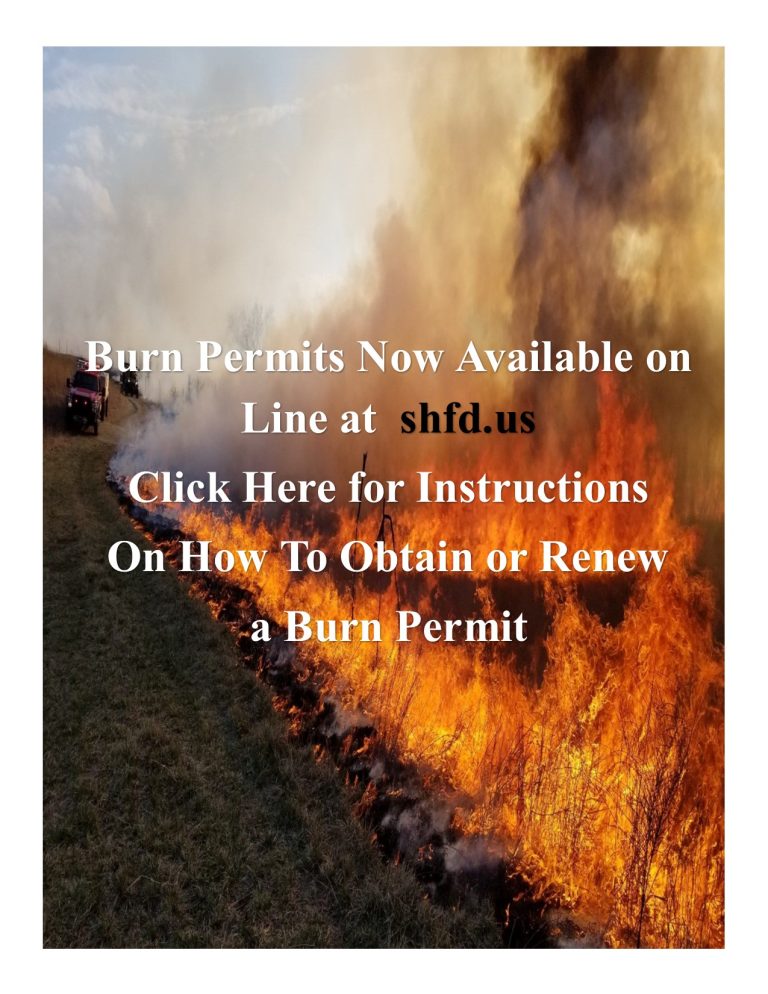 A controlled fire burns along a grassy field with smoke and flames visible. Text reads: Burn Permits Now Available online at shfd.us. Click here for instructions on how to obtain or renew a burn permit.